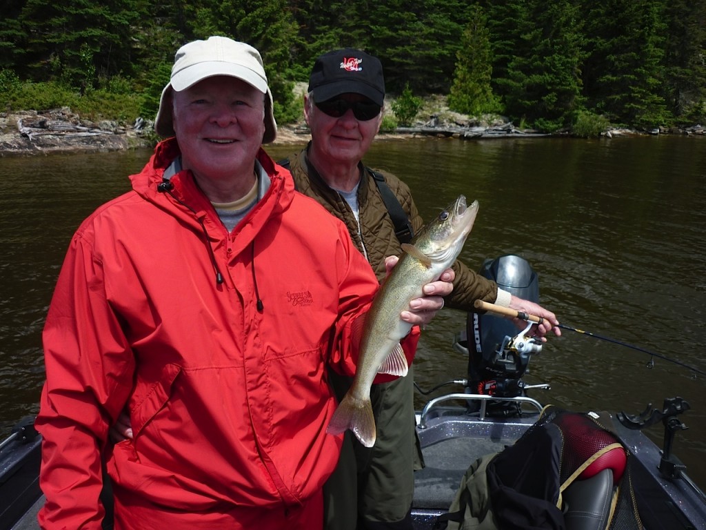 Denny and Dave with a typical Canada walleye and beautiful backdrop.