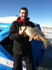 Jesse's monster carp brought up the ice hole!