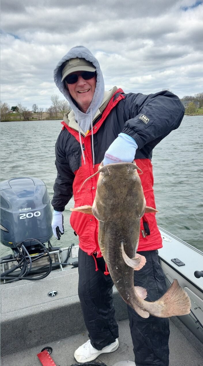 Chuck T with a channel cat at Lake McBride