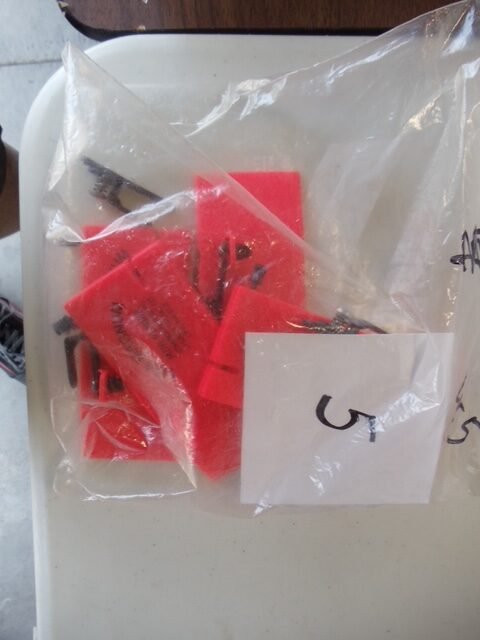 Row of fishing rods and gear on display (gallery view)