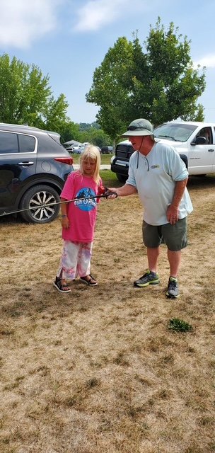 Volunteer assisting anglers at Fish-O-Rama (gallery view)