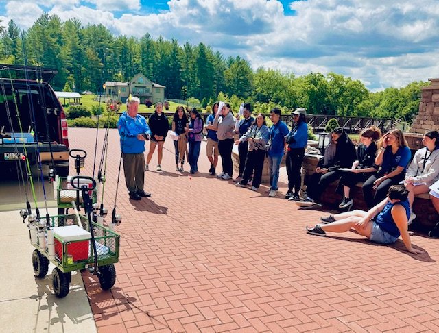 Staff gathered at the Camp Courageous Fish House during training