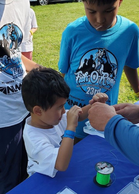 Close-up of knot-tying instruction at Fish-O-Rama 2025 (gallery view)